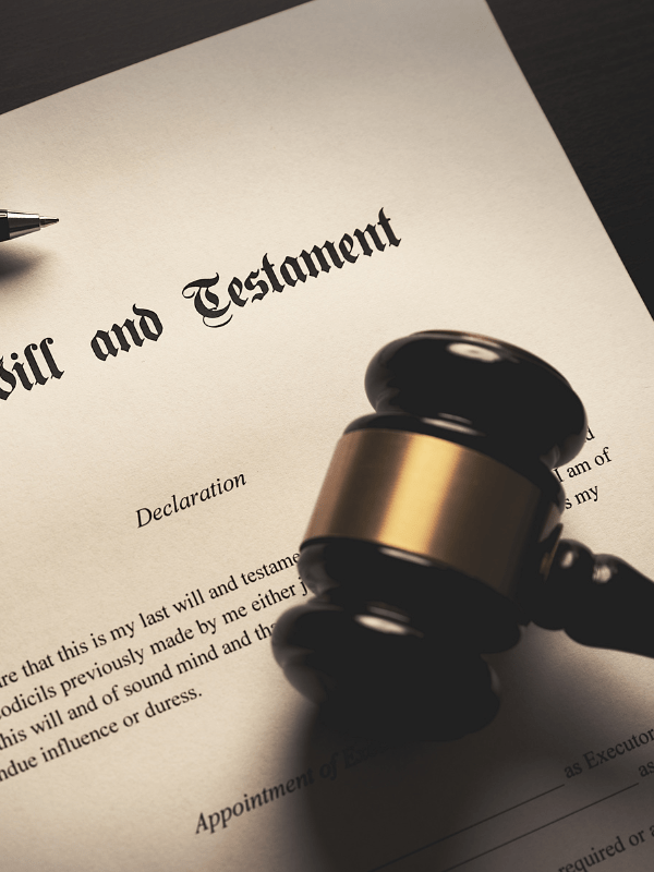 Fountain pen on a legal document with law books