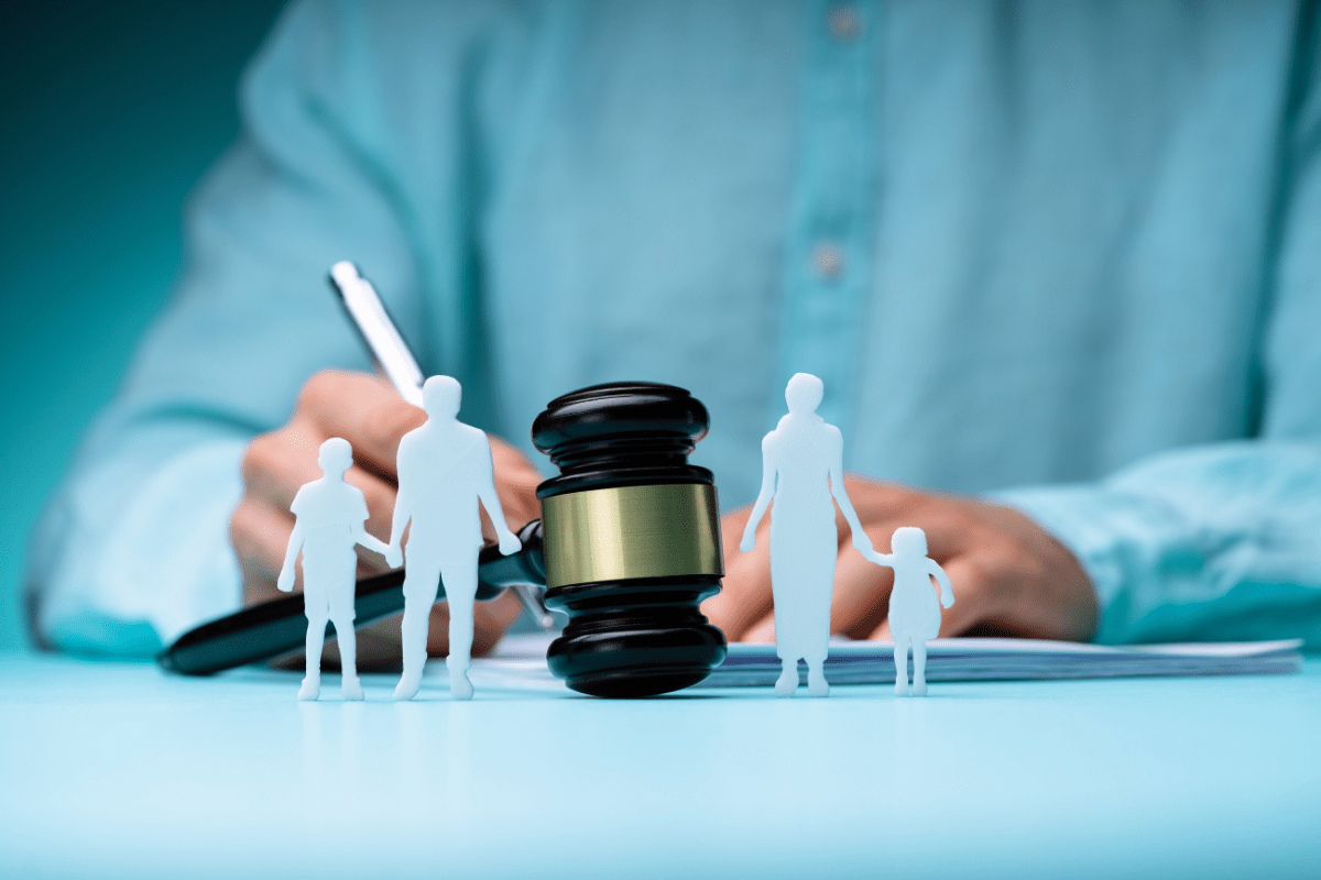 Gavel with family figures paper cutout
